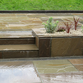 Patio with natural sandstone in havering