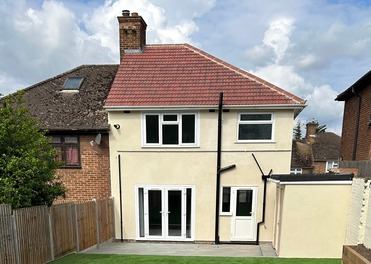 Porcelain Patios and steps, Lawn, flowerbeds and fencing. Rendered outbuilding and house. Romford Essex